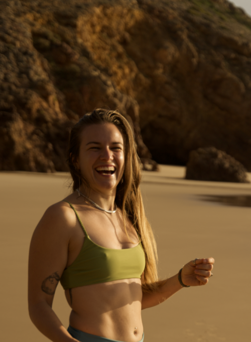 Minimalist green bikini set made from ECONYL® regenerated nylon, offering a sleek, eco-conscious swimwear choice. A sporty eco-friendly bikini top and sporty eco-friendly bikini bottom.