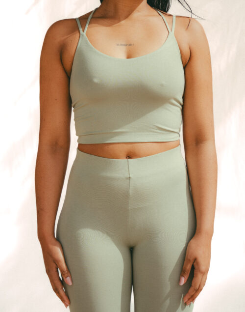 Reversible multiway strap yoga top in light olive green and cognac (Pistacia) made from soft bamboo fabric, sustainable strappy yoga wear