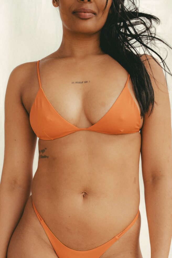 Reversible triangle bikini top in warm orange and bright green by COCOU
