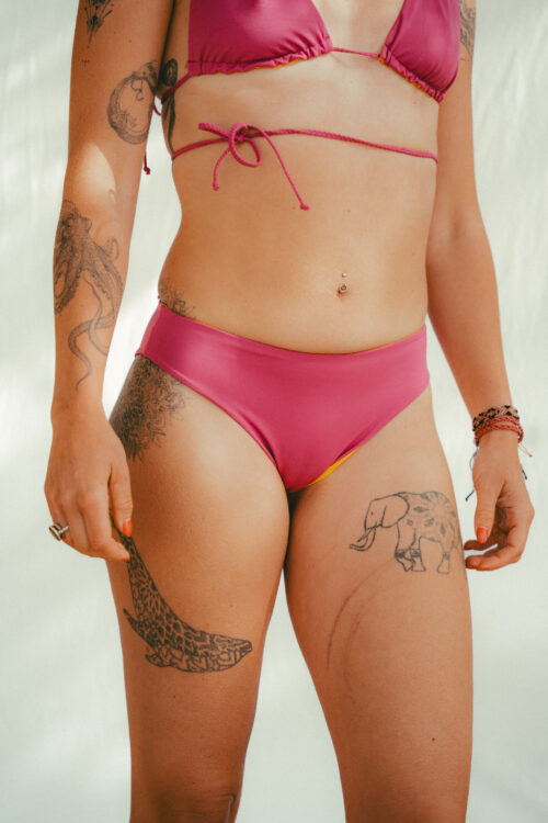 Full coverage reversible bikini bottom in dark pink and warm yellow by COCOU